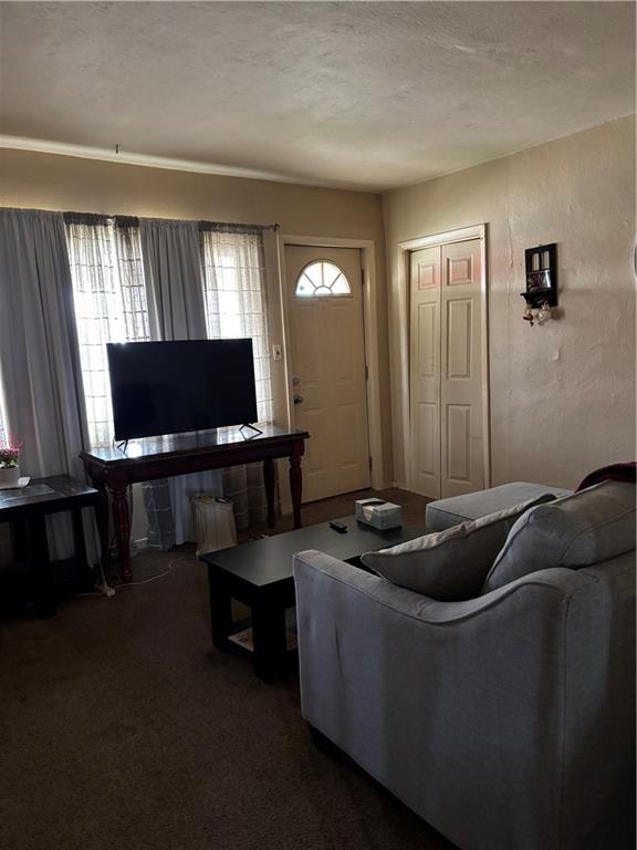 421-423 Georgetown Road Lawrence, PA 15055 - Photo 6 of 27 a living room with furniture and a flat screen tv