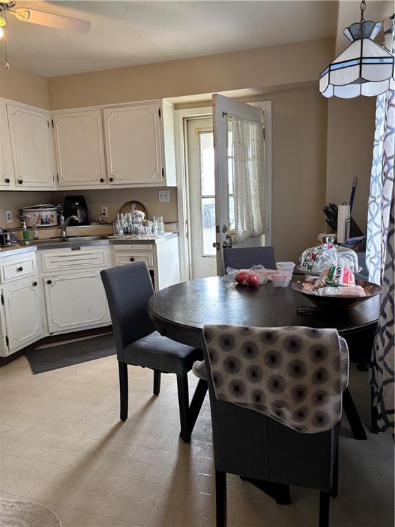 421-423 Georgetown Road Lawrence, PA 15055 - Photo 9 of 27 a kitchen with a dining table and chairs