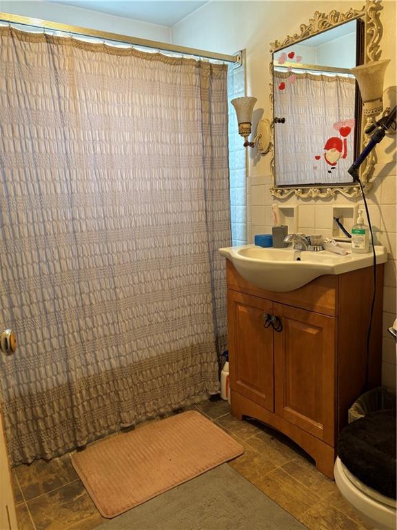 421-423 Georgetown Road Lawrence, PA 15055 - Photo 10 of 27 a bathroom with a sink and a shower curtain