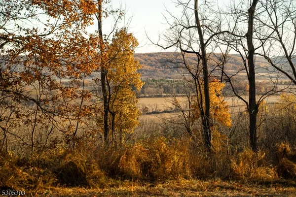 an aerial view of mountain with lake view