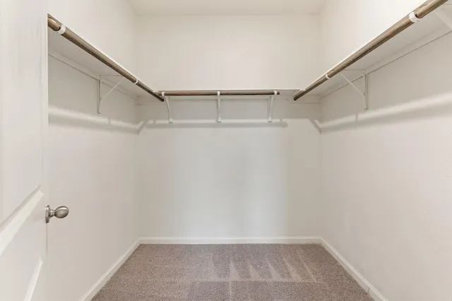 a view of an empty walk in closet
