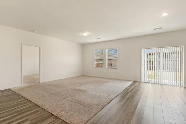 a view of a livingroom with wooden floor