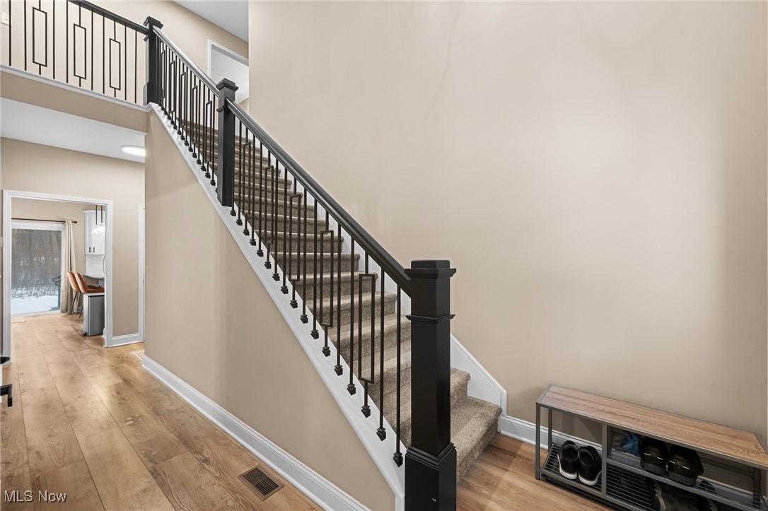 39600 Aurora Road Solon, OH 44139 - Photo 5 of 49 Staircase featuring a towering ceiling