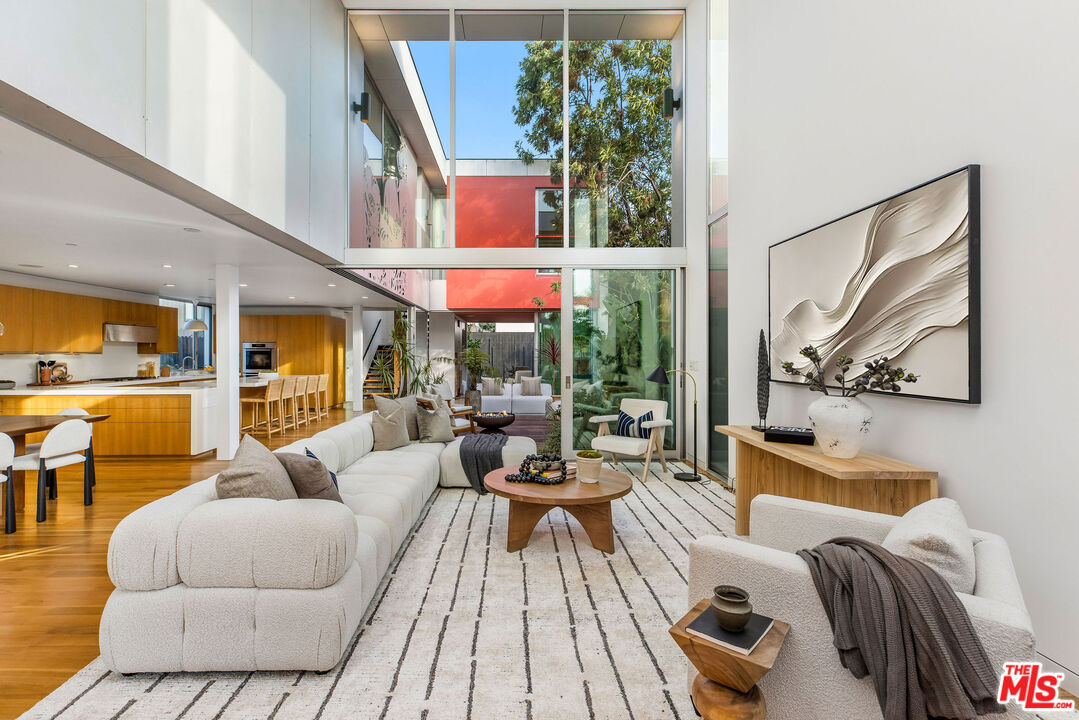 732 Brooks Avenue Venice, CA 90291 - Photo 3 of 28 a living room with furniture and a large window
