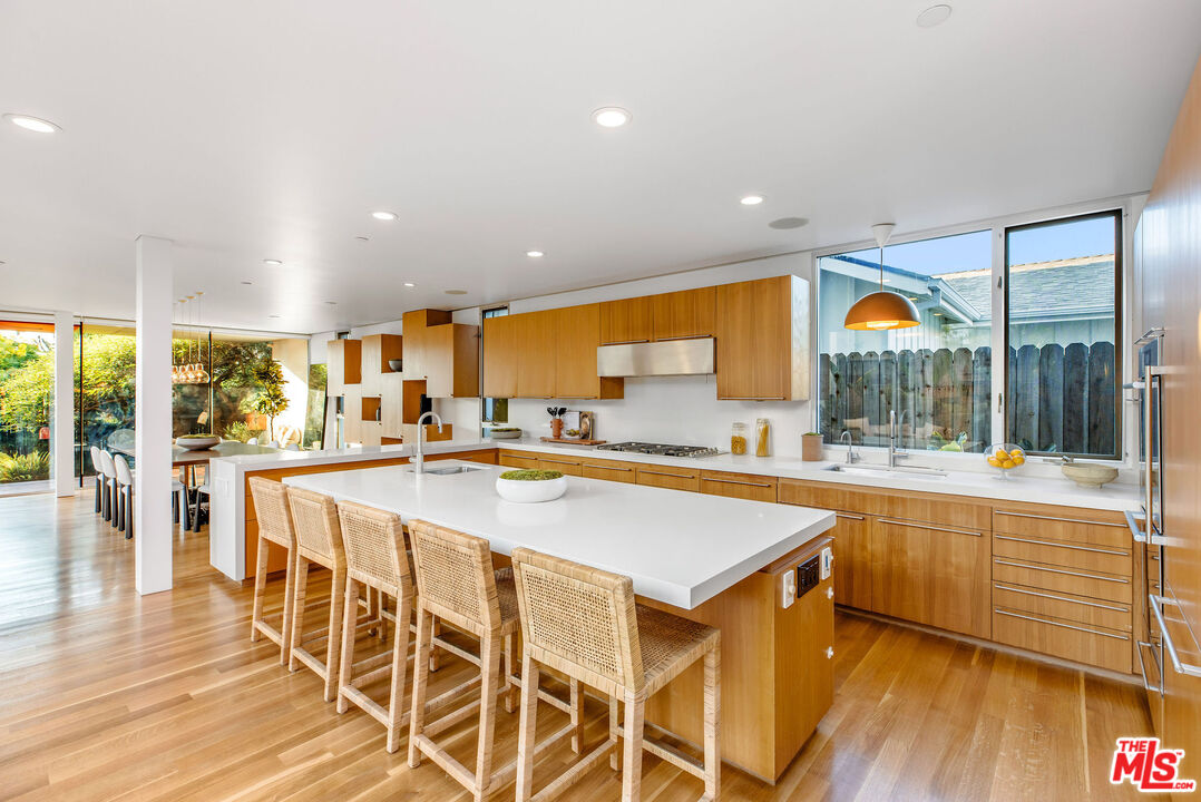 732 Brooks Avenue Venice, CA 90291 - Photo 10 of 28 a large kitchen with a table and chairs in it