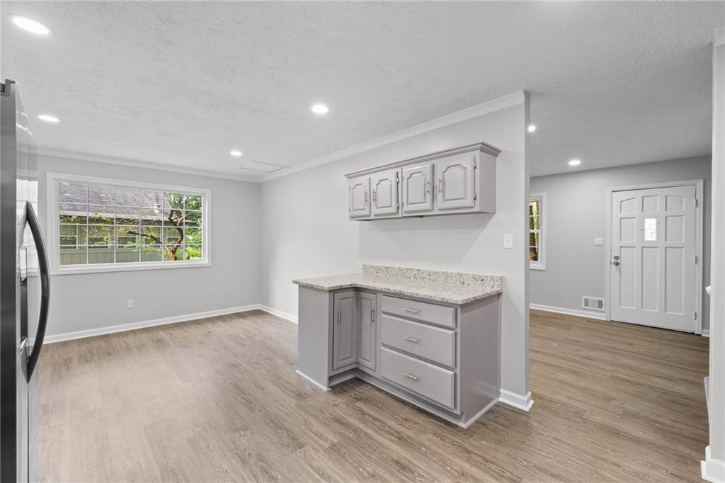 4510 Virginia Avenue Kennesaw, GA 30144 - Photo 12 of 54 an entryway with hallway and wooden floor