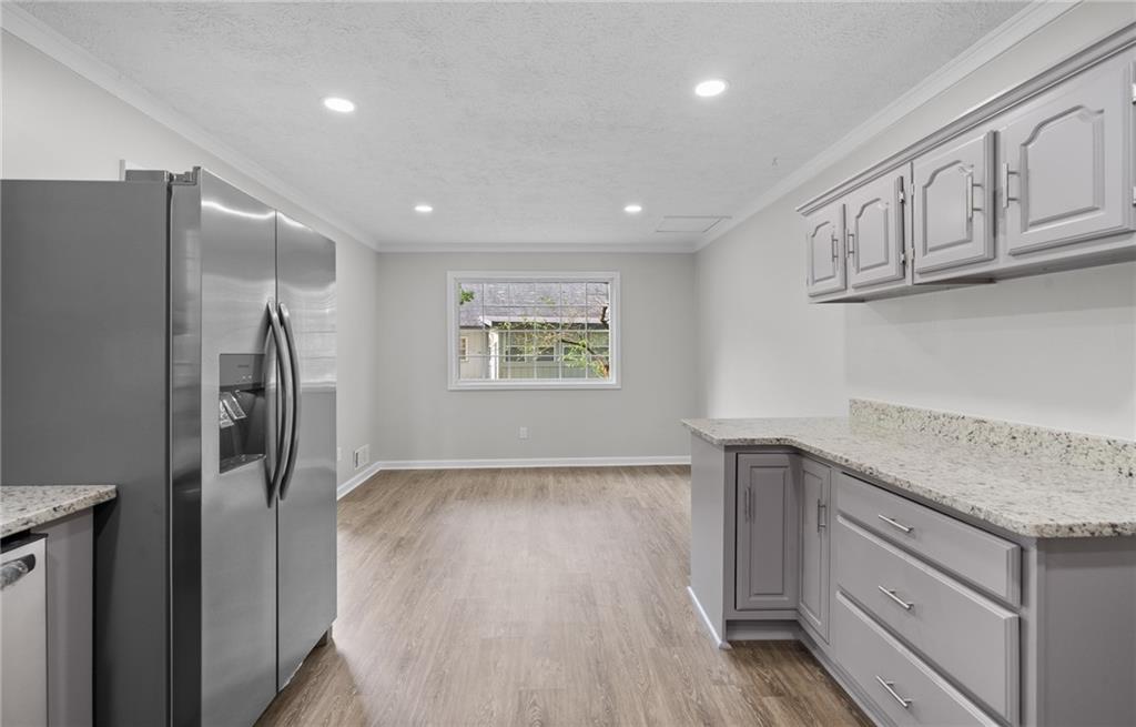 4510 Virginia Avenue Kennesaw, GA 30144 - Photo 13 of 54 a kitchen with stainless steel appliances granite countertop a refrigerator and a sink