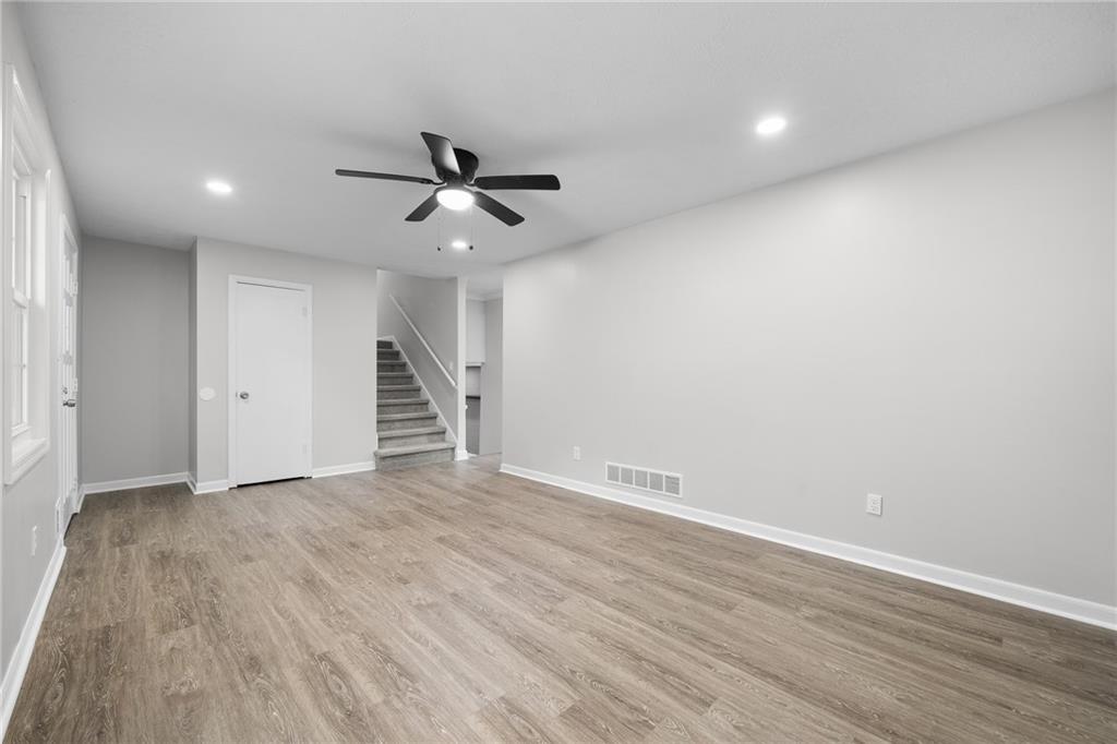 4510 Virginia Avenue Kennesaw, GA 30144 - Photo 21 of 54 a view of empty room with wooden floor and ceiling fan