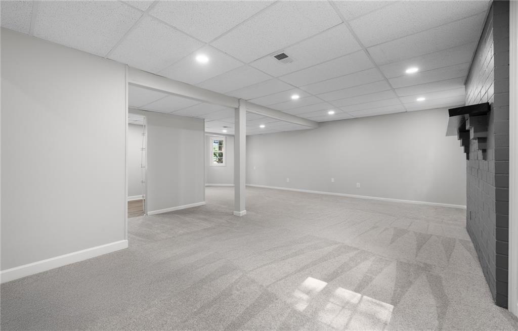 4510 Virginia Avenue Kennesaw, GA 30144 - Photo 23 of 54 an empty room with a empty space and windows