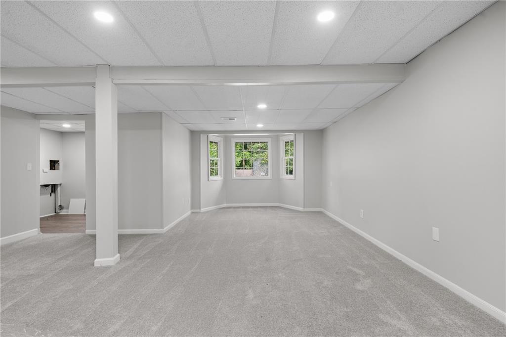 4510 Virginia Avenue Kennesaw, GA 30144 - Photo 24 of 54 wooden floor in an empty room with a window