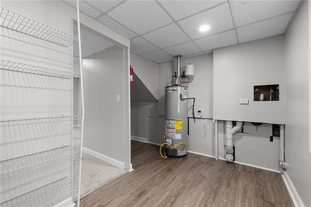 4510 Virginia Avenue Kennesaw, GA 30144 - Photo 30 of 54 a view of a livingroom with wooden floor and a fireplace