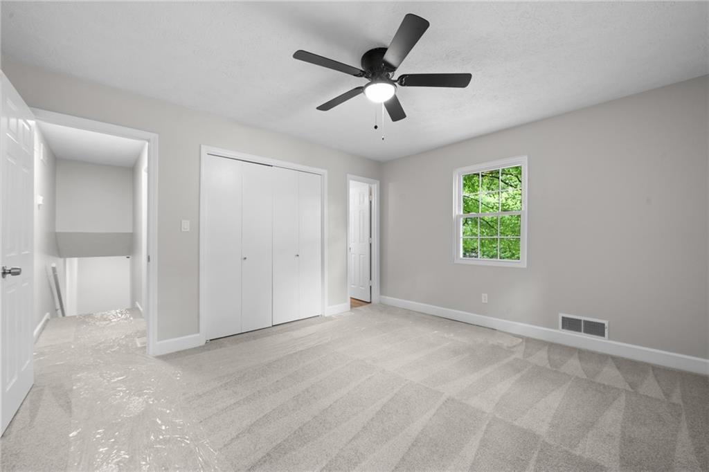 4510 Virginia Avenue Kennesaw, GA 30144 - Photo 32 of 54 a view of an empty room with a window