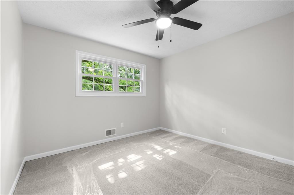 4510 Virginia Avenue Kennesaw, GA 30144 - Photo 40 of 54 an empty room with a window