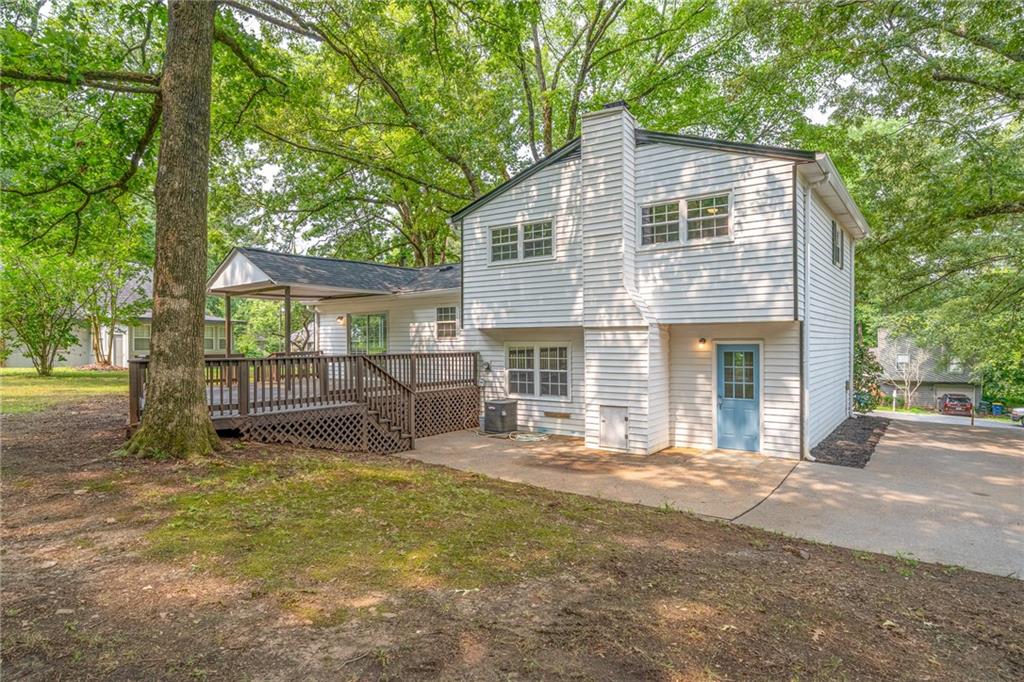 4510 Virginia Avenue Kennesaw, GA 30144 - Photo 43 of 54 a view of a house with a yard and sitting area