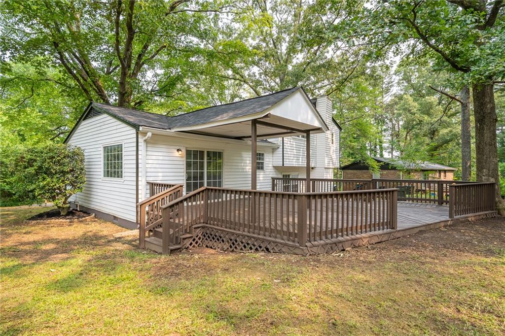 4510 Virginia Avenue Kennesaw, GA 30144 - Photo 45 of 54 a view of a house with a small yard and wooden fence