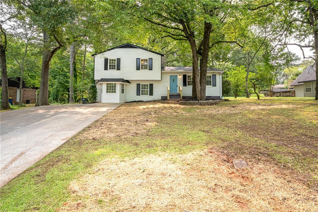 4510 Virginia Avenue Kennesaw, GA 30144 - Photo 5 of 54 a front view of a house with a garden