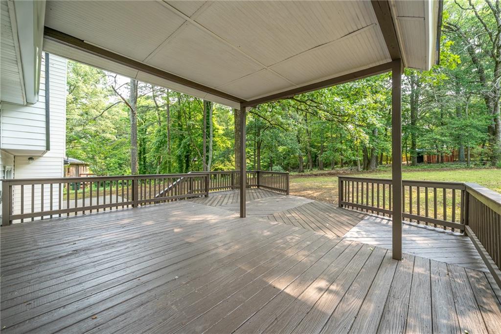 4510 Virginia Avenue Kennesaw, GA 30144 - Photo 54 of 54 a view of a wooden deck with a yard