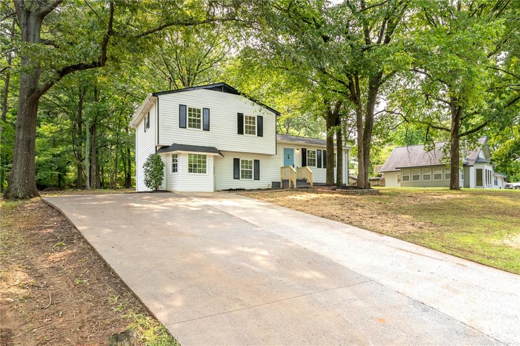 4510 Virginia Avenue Kennesaw, GA 30144 - Photo 6 of 54 a front view of a house with a yard