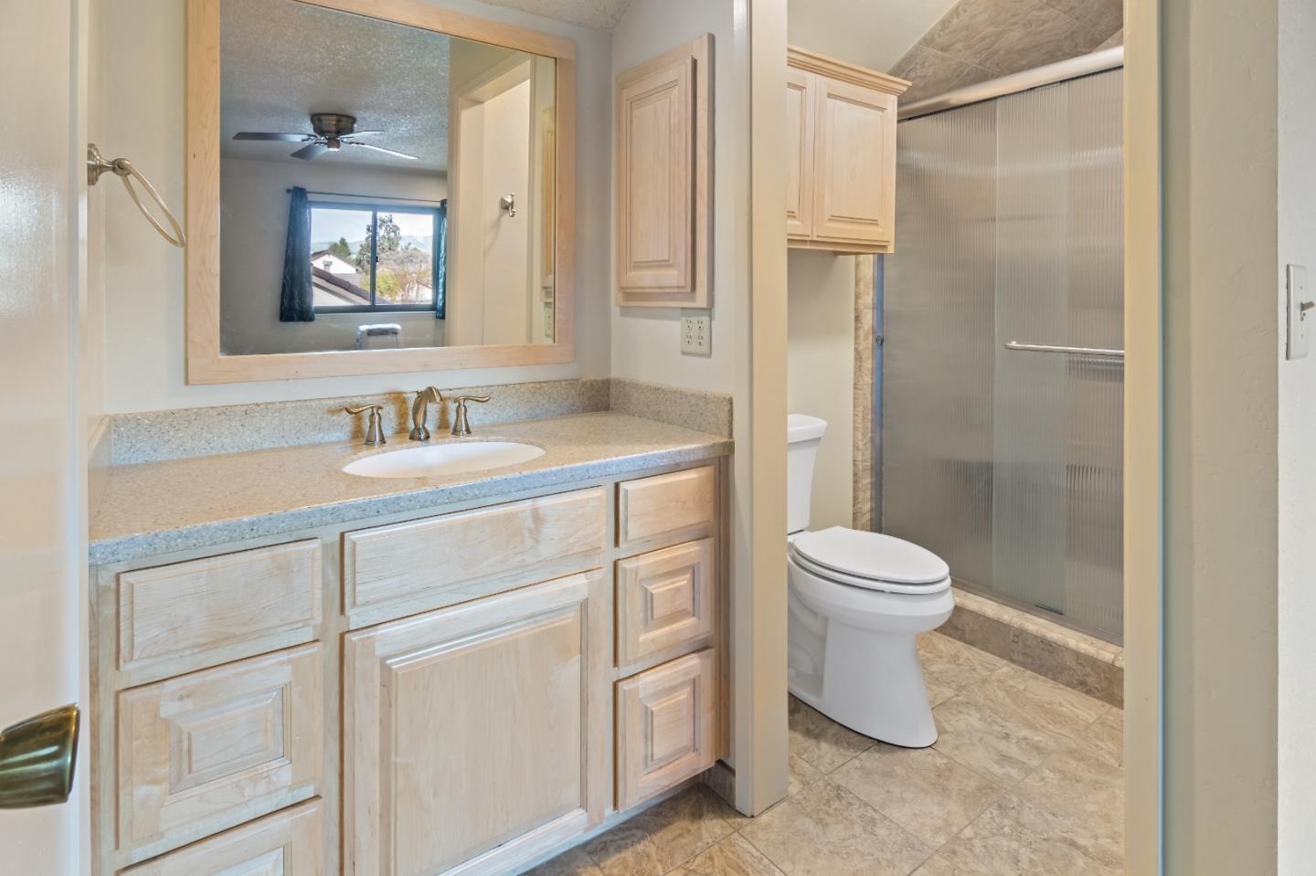 88 River Drive King City, CA 93930 - Photo 13 of 15 a bathroom with a toilet sink and a mirror