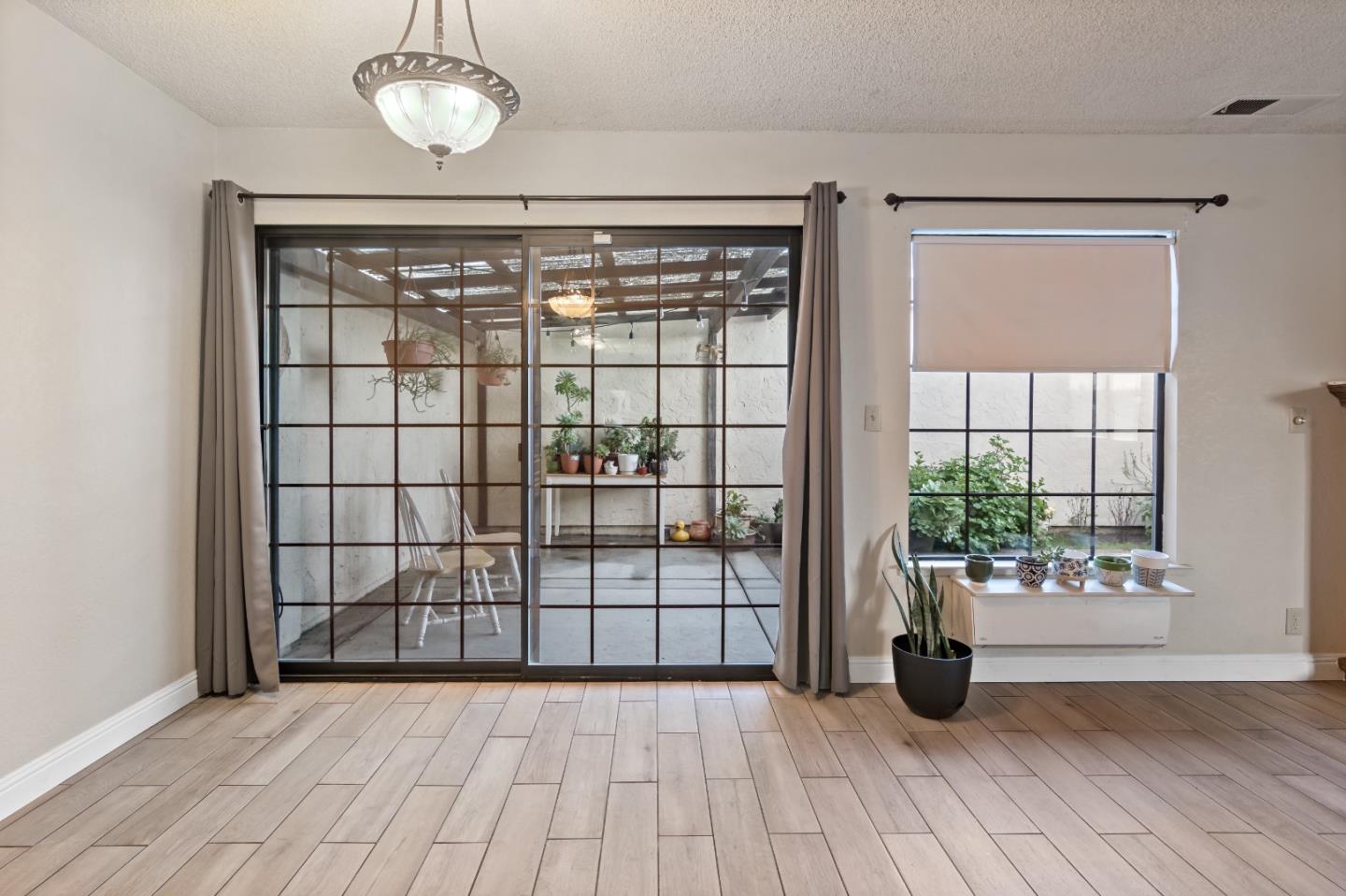 88 River Drive King City, CA 93930 - Photo 8 of 15 an empty room with wooden floor and windows