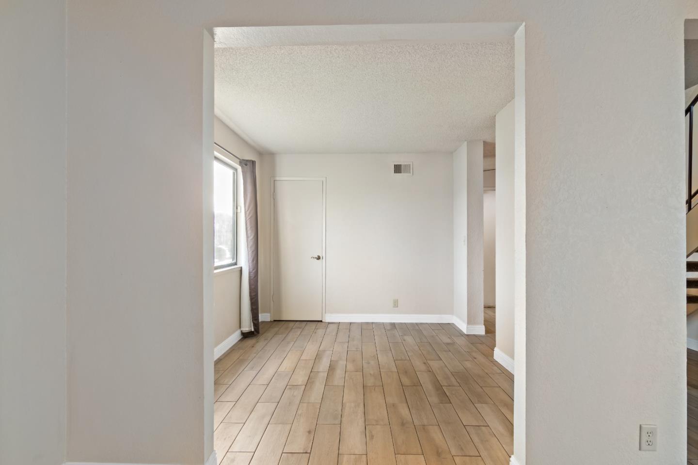 88 River Drive King City, CA 93930 - Photo 9 of 15 a view of a room with wooden floor and a window