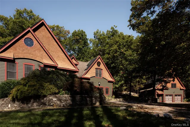 a view of house with a yard