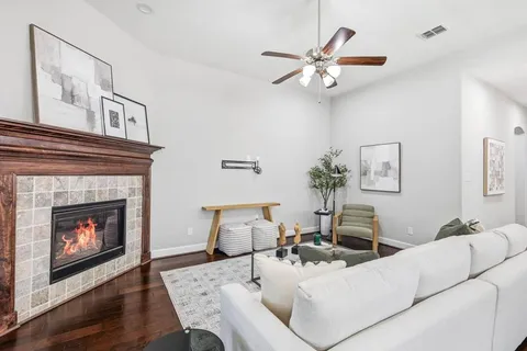 a living room with furniture and a fireplace