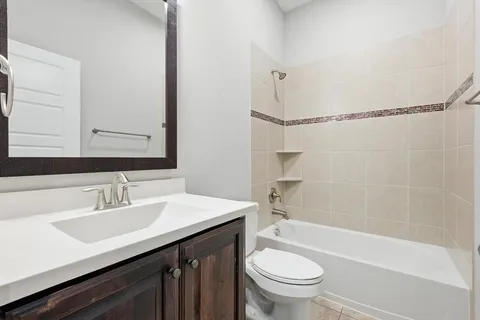a bathroom with a sink a toilet and a bathtub