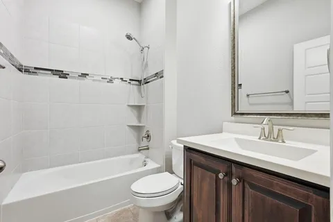 a bathroom with a sink a toilet and a bathtub