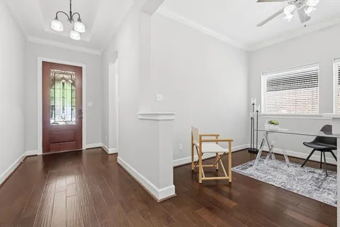 a view of a livingroom with furniture and wooden floor