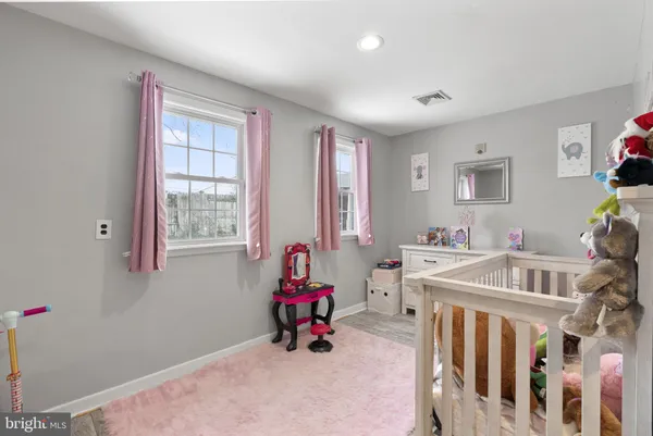 a bedroom with furniture and windows