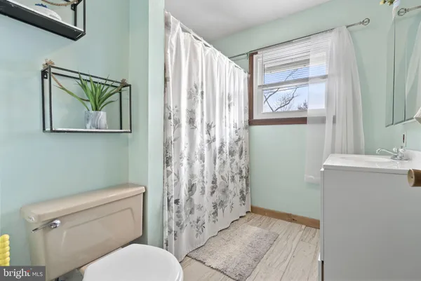 a bathroom with a toilet sink and tub