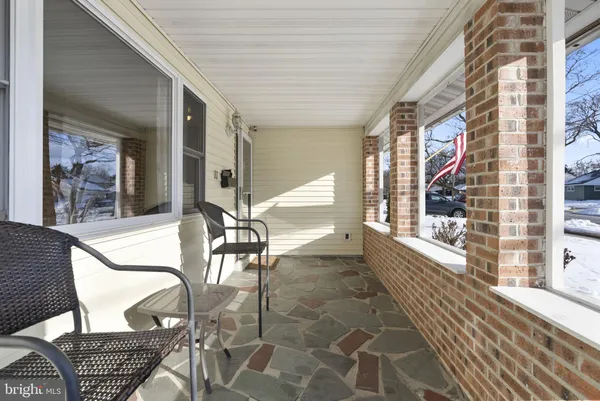 a view of a balcony with chairs