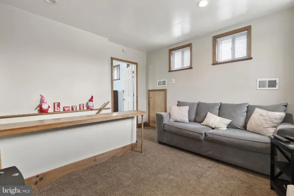 a living room with furniture and couch