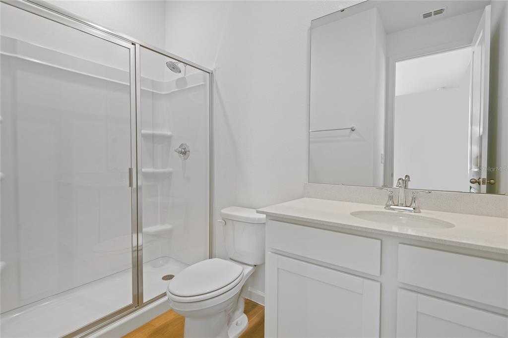 6168 Southwest 64th Terrace Ocala, FL 34474 - Photo 13 of 24 a bathroom with a sink toilet and shower