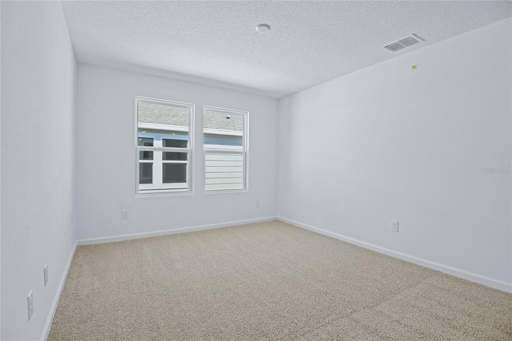 6168 Southwest 64th Terrace Ocala, FL 34474 - Photo 14 of 24 a view of empty room with windows