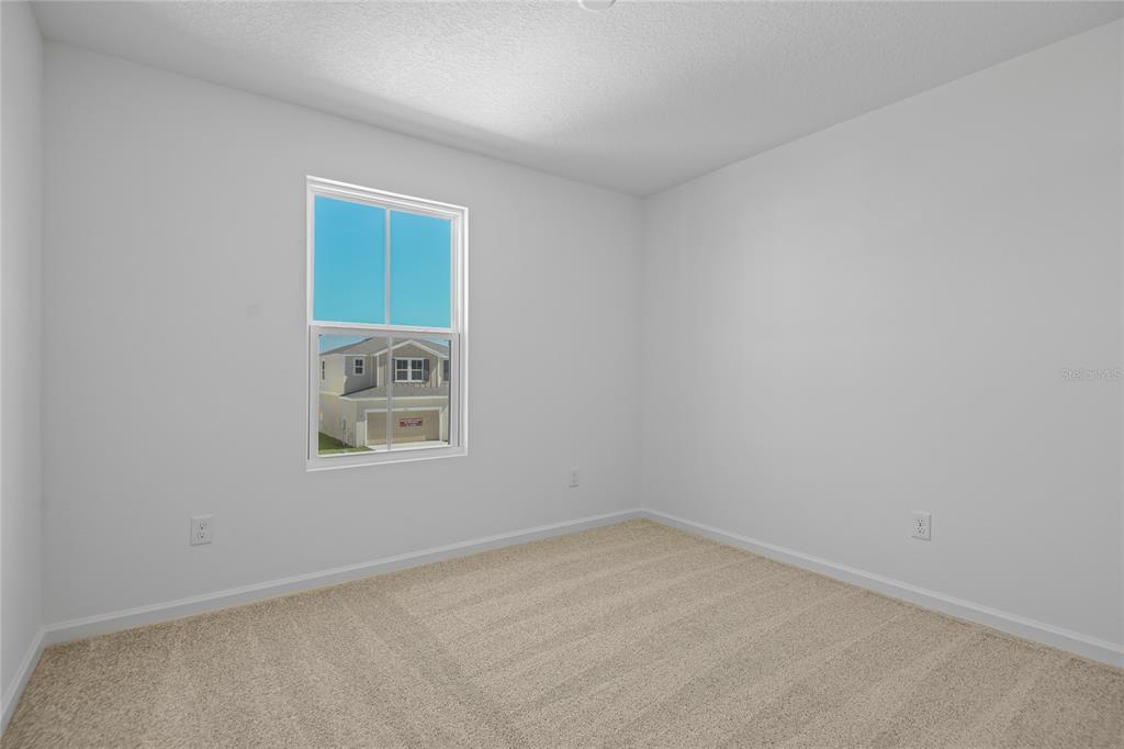 6168 Southwest 64th Terrace Ocala, FL 34474 - Photo 18 of 24 an empty room with a window