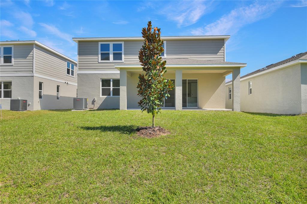6168 Southwest 64th Terrace Ocala, FL 34474 - Photo 21 of 24 a front view of a house with garden