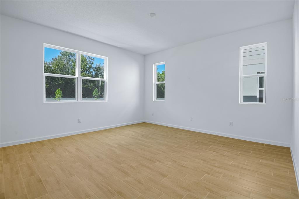 6168 Southwest 64th Terrace Ocala, FL 34474 - Photo 8 of 24 an empty room with a window