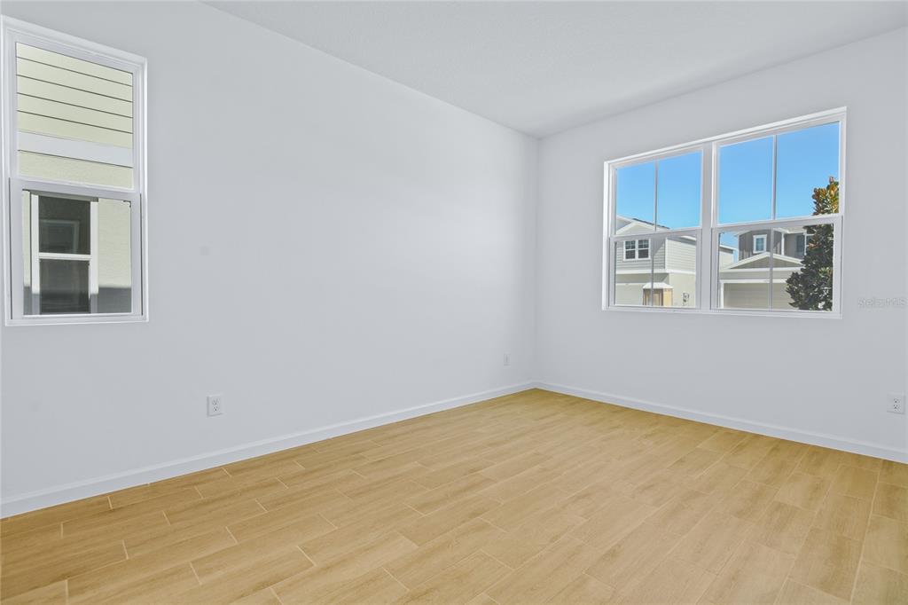 6168 Southwest 64th Terrace Ocala, FL 34474 - Photo 10 of 24 a view of a kitchen with stainless steel appliances wooden floor and a window