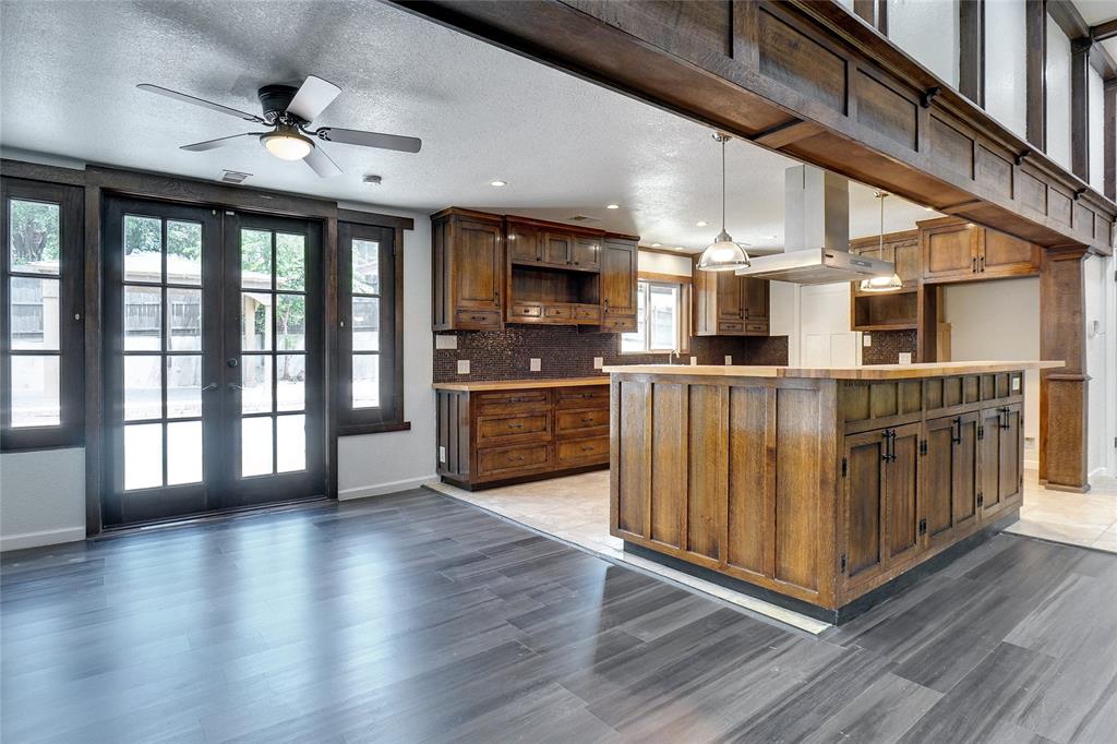 8900 Random Road Fort Worth, TX 76179 - Photo 4 of 18 a open kitchen with stainless steel appliances granite countertop a refrigerator a stove a sink and a microwave oven with wooden floor