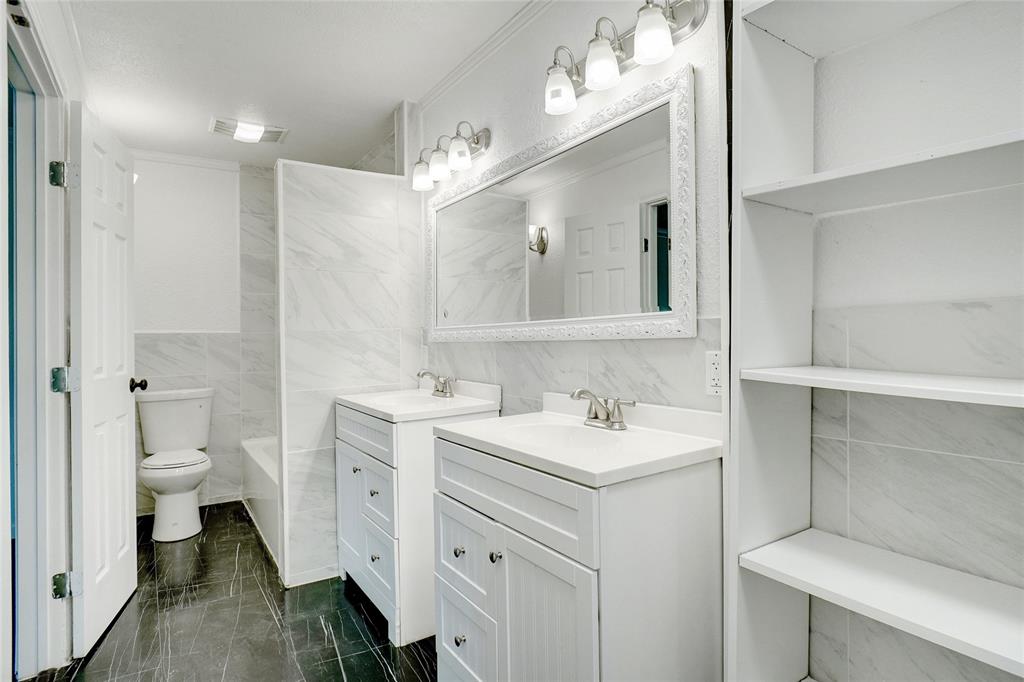8900 Random Road Fort Worth, TX 76179 - Photo 9 of 18 a spacious bathroom with a sink toilet and mirror