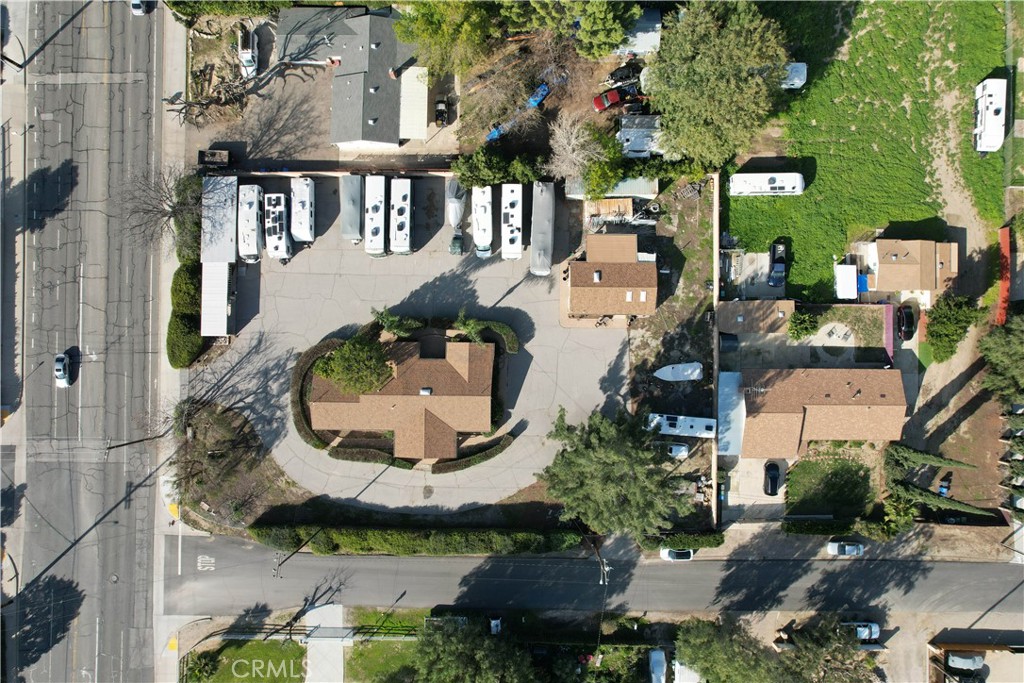 an aerial view of a residential apartment building with a yard