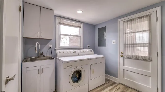 a view of a balcony with wooden floor and seating space