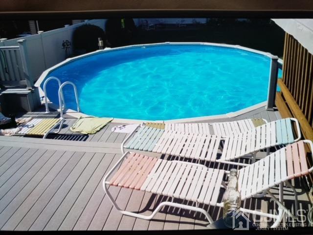 164 Normandy Road Colonia, NJ 07067 - Photo 3 of 47 a view of a swimming pool