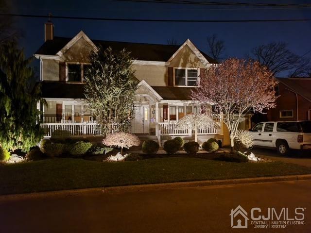 164 Normandy Road Colonia, NJ 07067 - Photo 6 of 47 a front view of a house with a parking lot