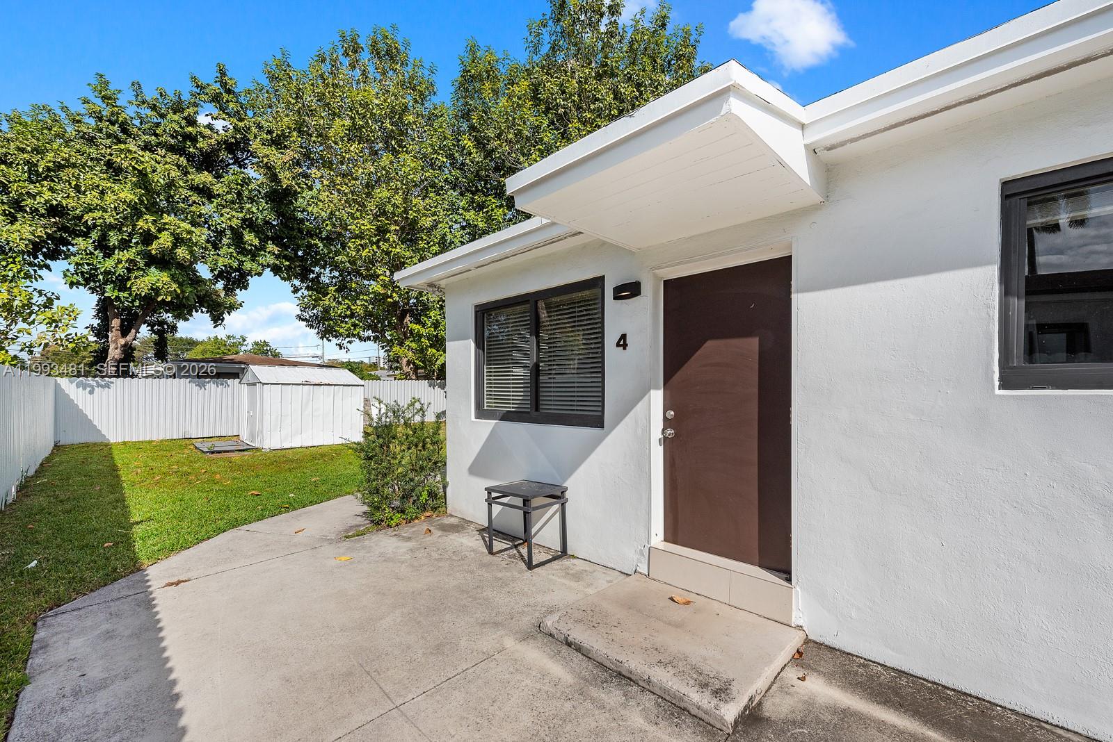 1911 Northwest 30th Street, Unit 4 Miami, FL 33142 - Photo 1 of 15 a view of an outdoor space and a yard