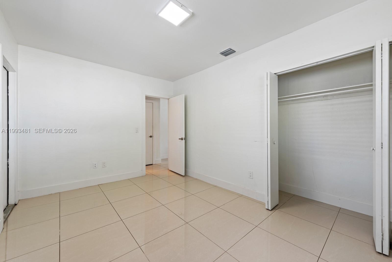 1911 Northwest 30th Street, Unit 4 Miami, FL 33142 - Photo 11 of 15 a view of an empty room
