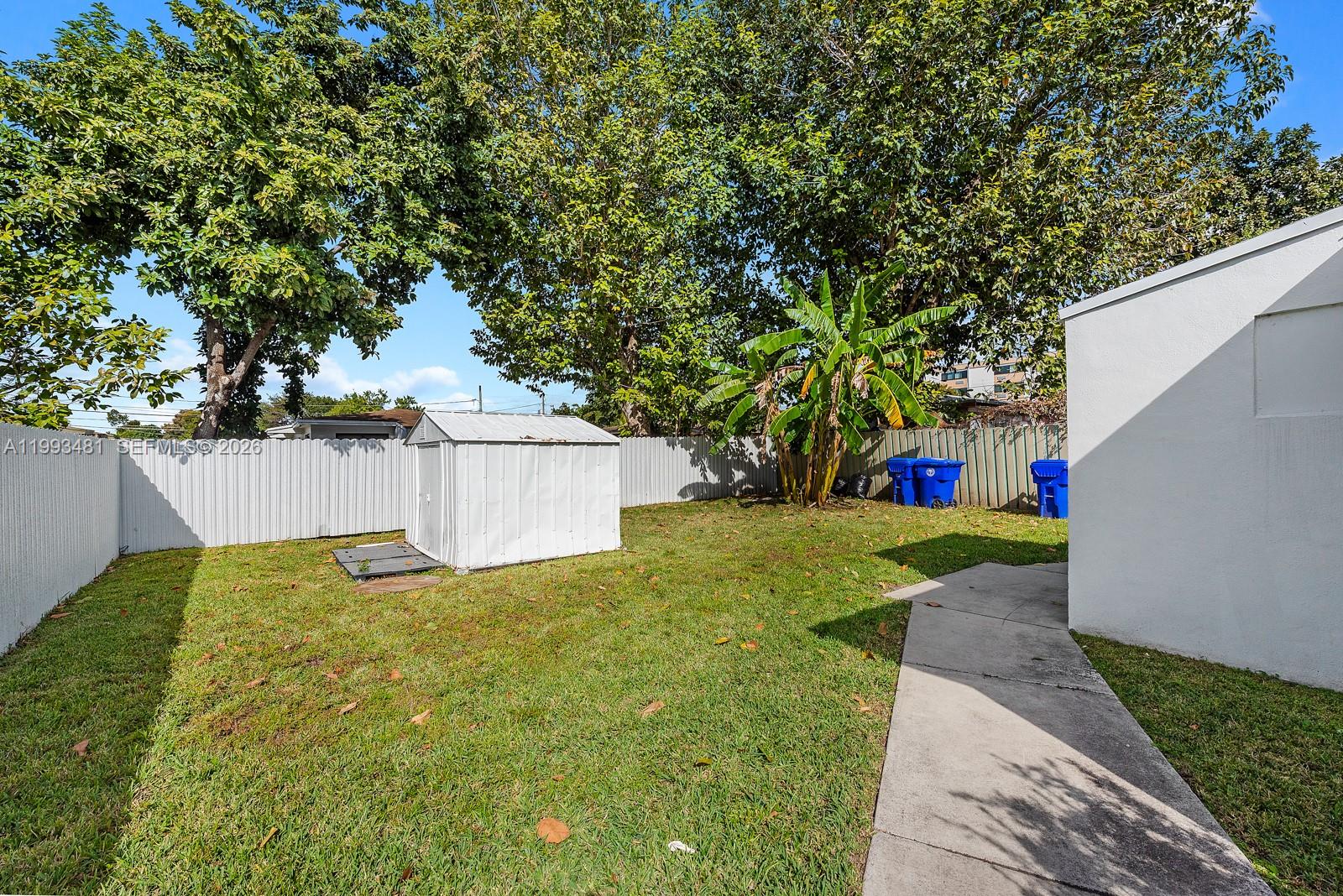 1911 Northwest 30th Street, Unit 4 Miami, FL 33142 - Photo 14 of 15 a view of a back yard