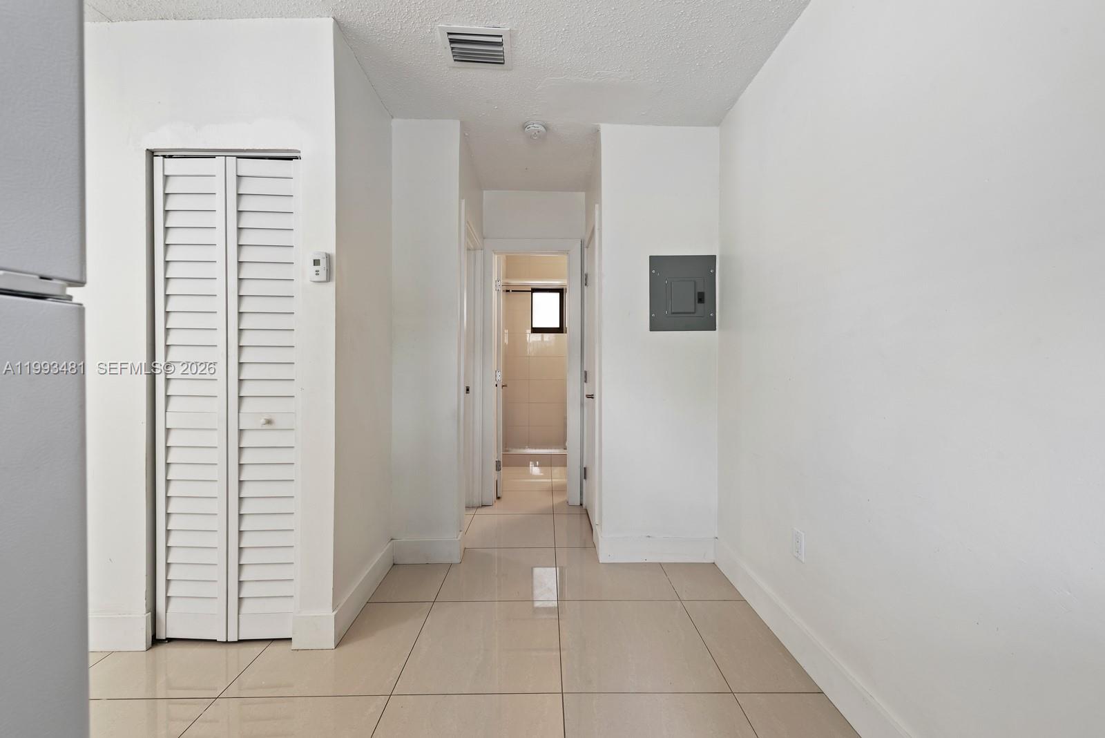 1911 Northwest 30th Street, Unit 4 Miami, FL 33142 - Photo 8 of 15 a view of a hallway and closet